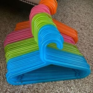 49 multi colored children’s sized plastic hangers 
Excellent condition
